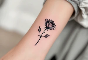 Simple black rose silhouette, no shading or color, for a bold minimalist look. tattoo idea