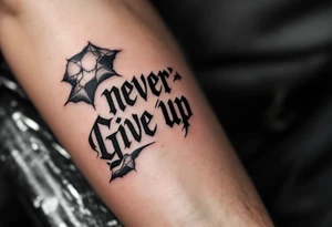 A bold gothic-style "never give up" in deep charcoal gray, framed by cracked stone textures. tattoo idea