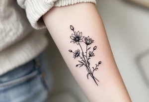 Dainty Stargazer lillies with small sunflowers and tulip buds in a dainty wildflower bouquet with stems tattoo idea
