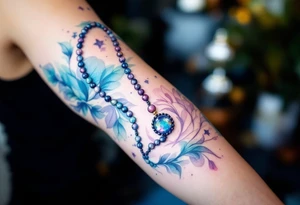 Prayer Beads (Mala) – A string of 108 beads used for chanting and meditation, ideal as a bracelet or anklet tattoo design. tattoo idea