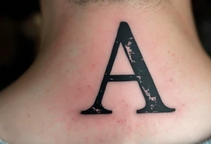 A classic typewriter-style "A" in charcoal black with distressed texture. tattoo idea