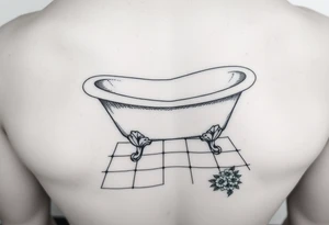 clawfoot bathtub with visible tile bathroom floor and a small bouqet of flowers on the floor tattoo idea