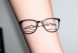 Landscape Reflecting Glasses
You can use the lenses of your glasses to depict a beautiful landscape, such as a sunset, a starry sky tattoo idea