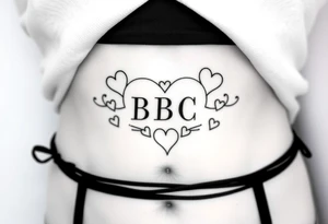 text reading "BBC" across a womb tattoo surrounded by hearts tattoo idea