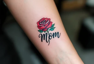 A red rose with a teal ribbon that wraps around with “Mom” in bold black ink. tattoo idea