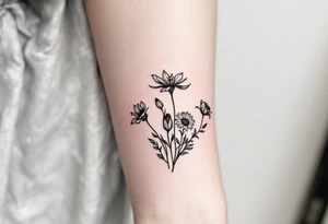 Stargazer lillies with small sunflowers and tulip buds in a dainty wildflower bouquet with stems tattoo idea
