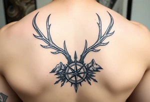 Spine tattoo of elk and deer antlers, a compass, and mountains tattoo idea