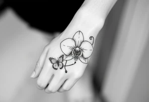 Orchid flower with two butterflies around it tattoo idea