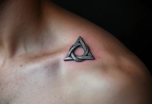 A silver metallic triquetra with a reflective shine, giving it a mystical and elegant appearance. tattoo idea