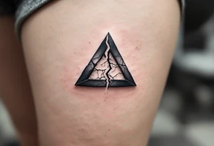 A broken triangle in gray ink with cracked textures, representing resilience and healing. tattoo idea