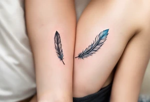 Two matching man and woman black feather tattoos with blue tips. tattoo idea