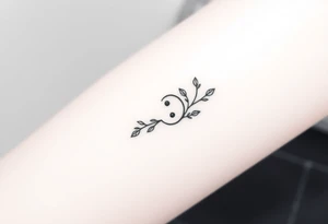 A delicate semicolon symbol intertwined with a vine, symbolizing growth, resilience, and new beginnings tattoo idea