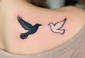 One partner wears a black crow in flight, and the other a white dove, symbolizing unity through contrast. tattoo idea