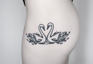 Peaceful swans feminine strength tattoo idea