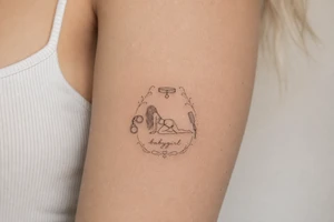 A tattoo for a submissive named babygirl, with a wrist cuffs, a collar, a paddle, and a minimalist line art female form that is kneeling and prone. tattoo idea