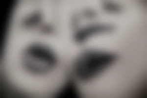 A tattoo of the lip of a beautiful woman's mouth biting on a roll of dollars, two ace cards are below her chin, city skyscrapers behind tattoo idea