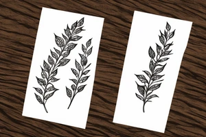 delicate fineline botanical tattoo of leaves branch with thyme flowers tattoo idea