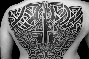 runic mark of the faceless warrior on the back tattoo idea