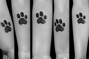 Dog paw integrated witty lucky charm leaf tattoo idea
