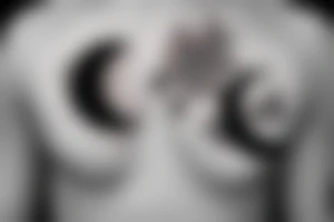 half moon with flowers on the chest tattoo idea