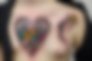 Glass heart surrounded by animals tattoo idea