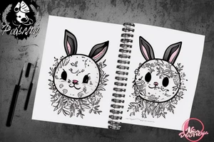 Fluffy bunny with glossy cutie eyes in bush tattoo idea