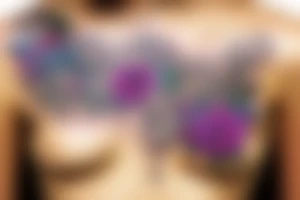 Psychedelic metal chains with flowers blooming on them tattoo idea
