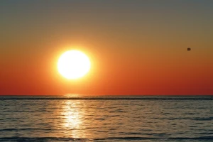 A simple, not very realistic, sunset on the sea, with morse code for RMJA as the sun's rays. Also include another A in morse code tattoo idea