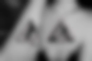 Sunrise over mountains in one triangle. Sunset over ocean in another triangle tattoo idea