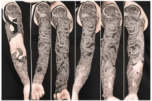 A sleeve where a snake is crawling down the arm. There's not much extra components, and the snake is in black and white, with some small orange/red accents tattoo idea