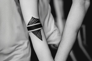 a black armband with a writing on it tattoo idea