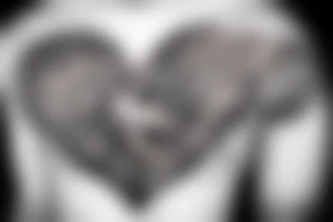 Heart being held down by chains and the brain tattoo idea