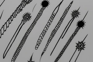 thin long spicky nail tattoo idea