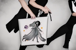 Woman with luggage walking on top of a large moon tattoo idea