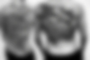 on the lower back of my back,  a shark is swimming in the ocean tattoo idea
