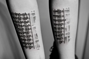 Hour glass tattoo with letters falling through from the phrase being true to her til my glass rubs out of sand tattoo idea