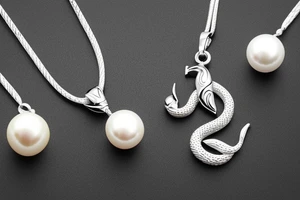 sea snake necklace with pearl pendant tattoo idea