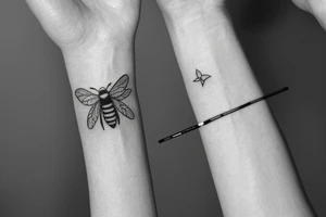 small honey bee with a small honeycomb on female wrist tattoo idea