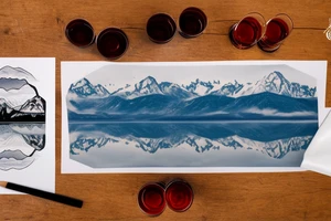 scenic view of a lake in Italy with the mountains in the background on the table in the foreground is a glass of negroni tattoo idea