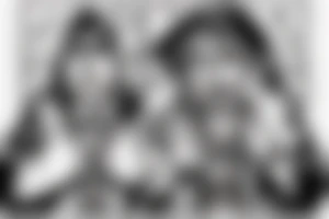 Man in a hoodie crying wearing a cross tattoo idea
