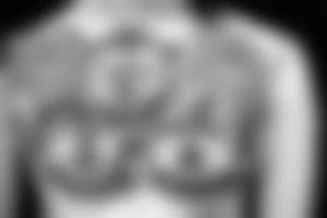 winking buddha lotus cameo tattoo idea