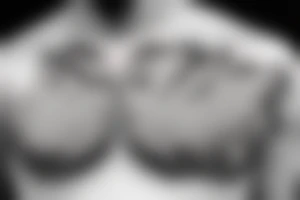 small devil wings on chest tattoo idea
