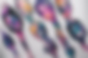 An hourglass full of a galaxy  dripping down leg tattoo idea