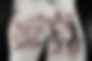 A womens body lines holding herself with a magnolia as head tattoo idea