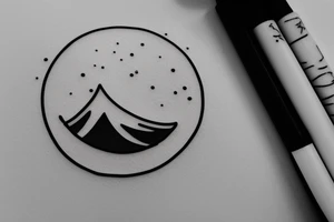 Black circular tattoo for a man that is minimalistic in design and is centred around mountains and snow tattoo idea