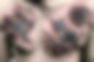 Two single rose branches with stems starting the the centre of the chest going in different directions following the shape of the chest tattoo idea