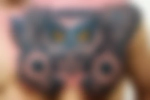 owl on the chest in the style of neotrad tattoo idea