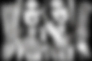 woman smoking a cigarette with tribal background tattoo idea