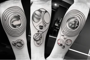 Pretty girl playing with planets the size of marbles tattoo idea