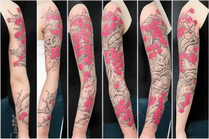 Cherry tree blossom detailed sleeve tattoo idea